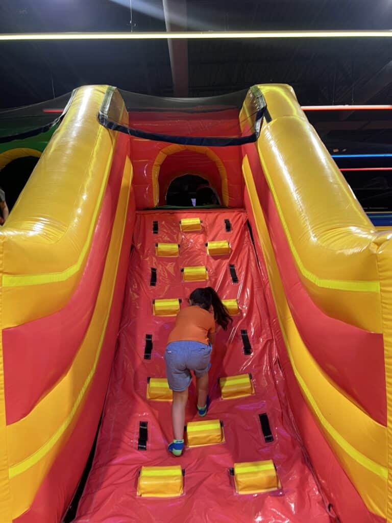 girl next to inflatable in funbox bowie Is Funbox Bowie Worth It for Families?