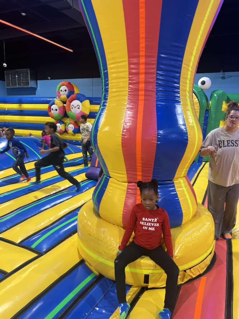 girl next to inflatable in funbox bowie Is Funbox Bowie Worth It for Families?